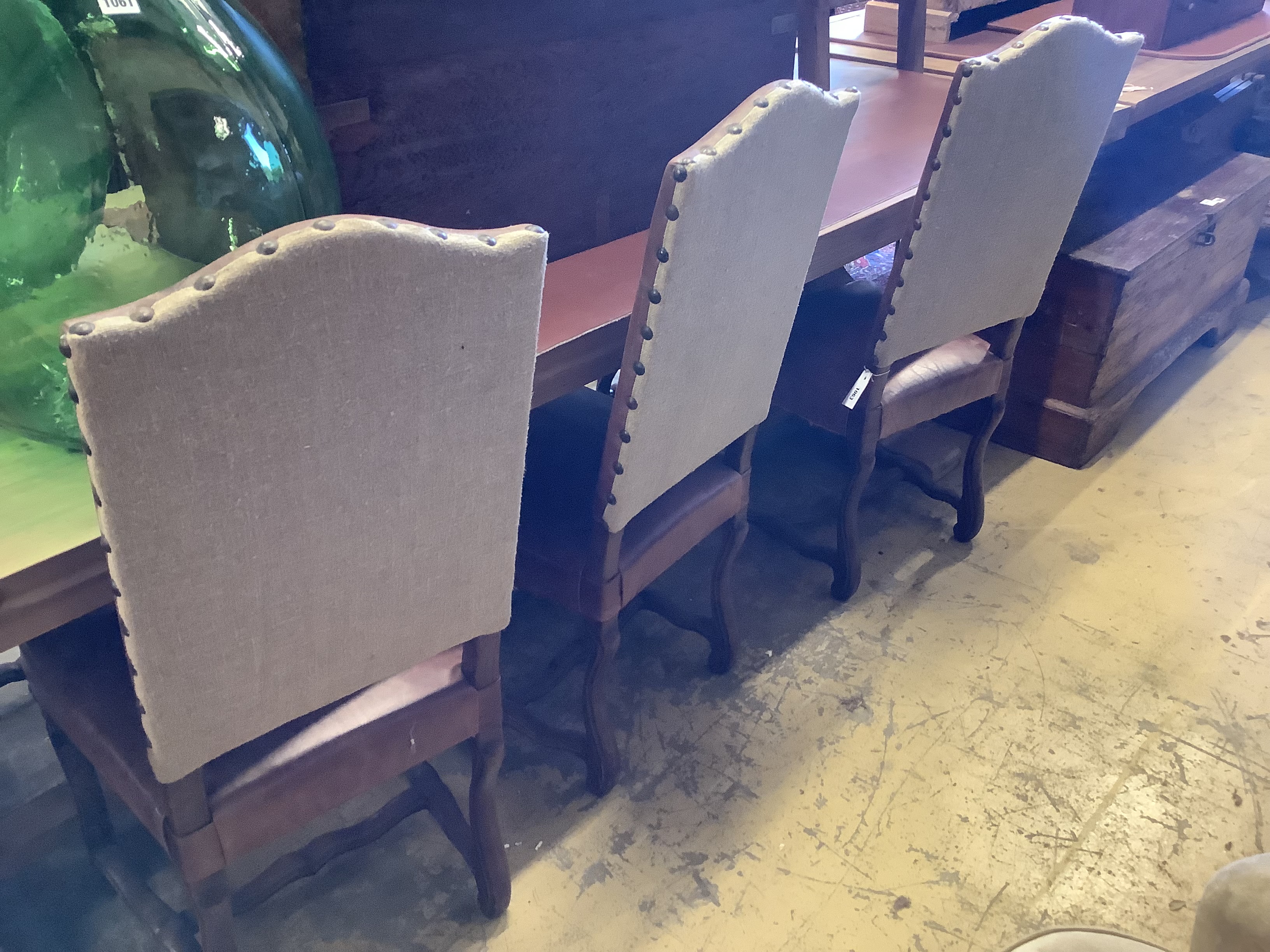 A set of six French leather high back dining chairs